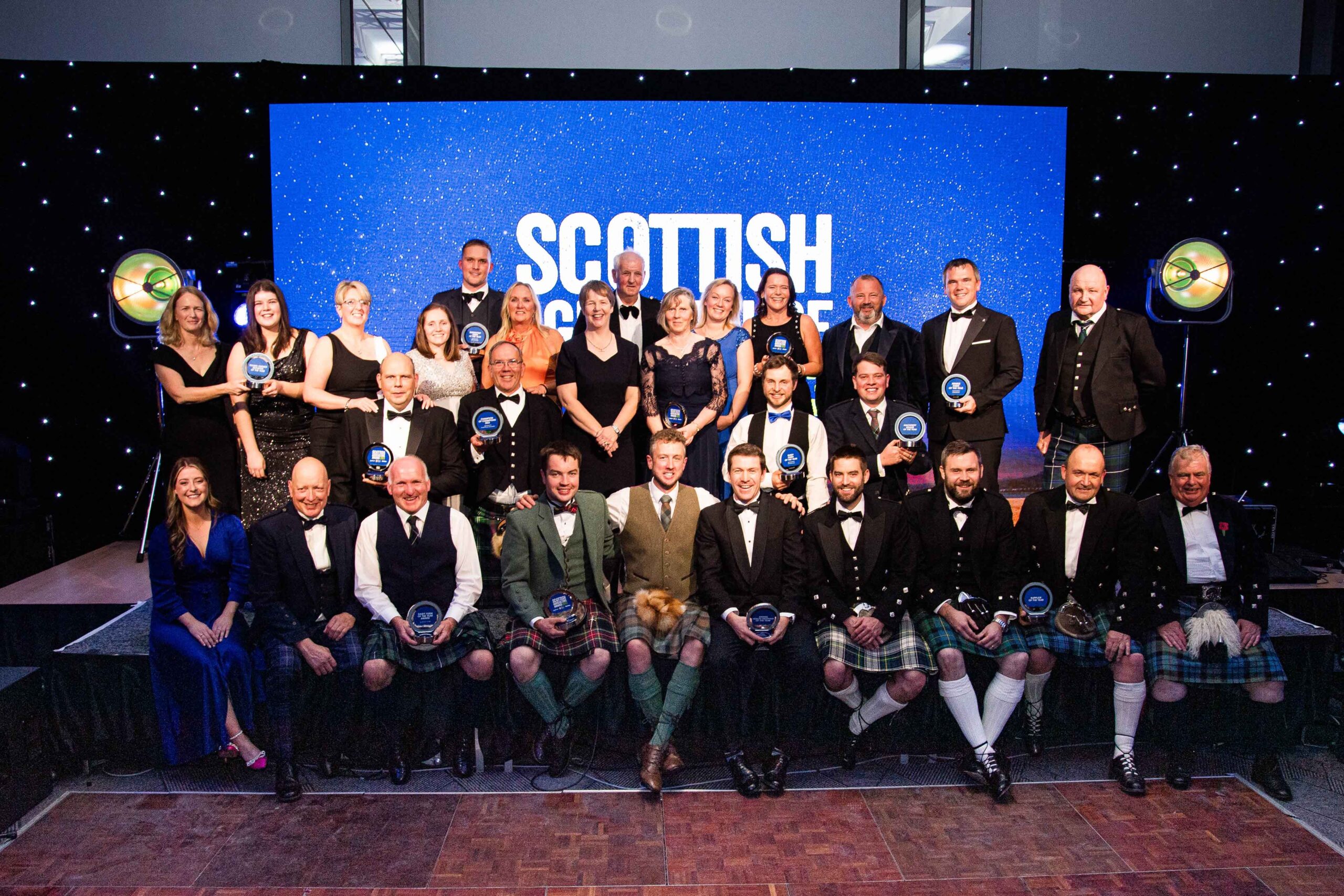 The winners for the Scottish Agricultural Award all stand together.
